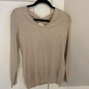 Beige long sleeve top with detailing in back